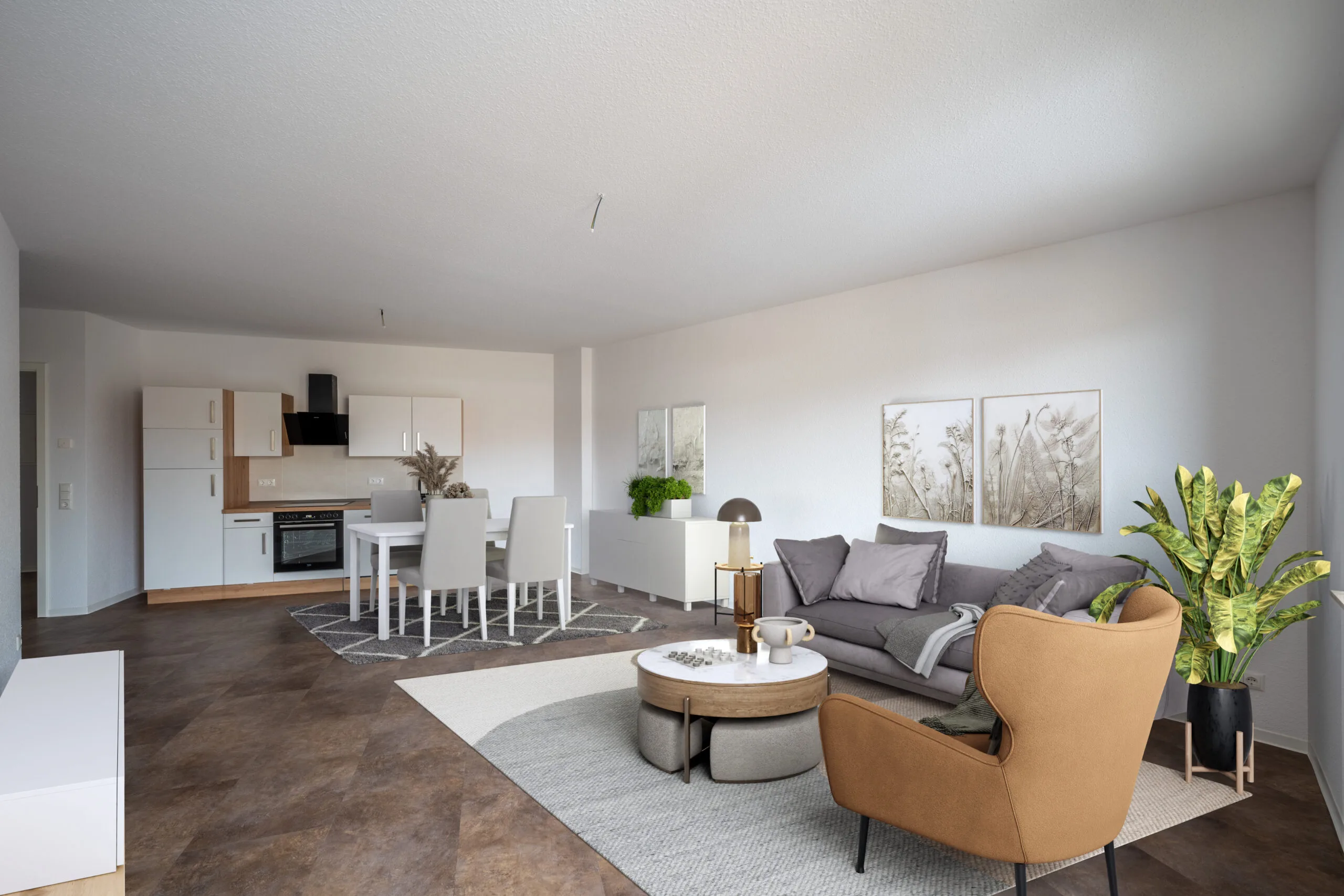Offener Wohnbereich mit Einbauküche, Esstisch mit vier Stühlen, Sofa, Sessel und großer Zimmerpflanze.